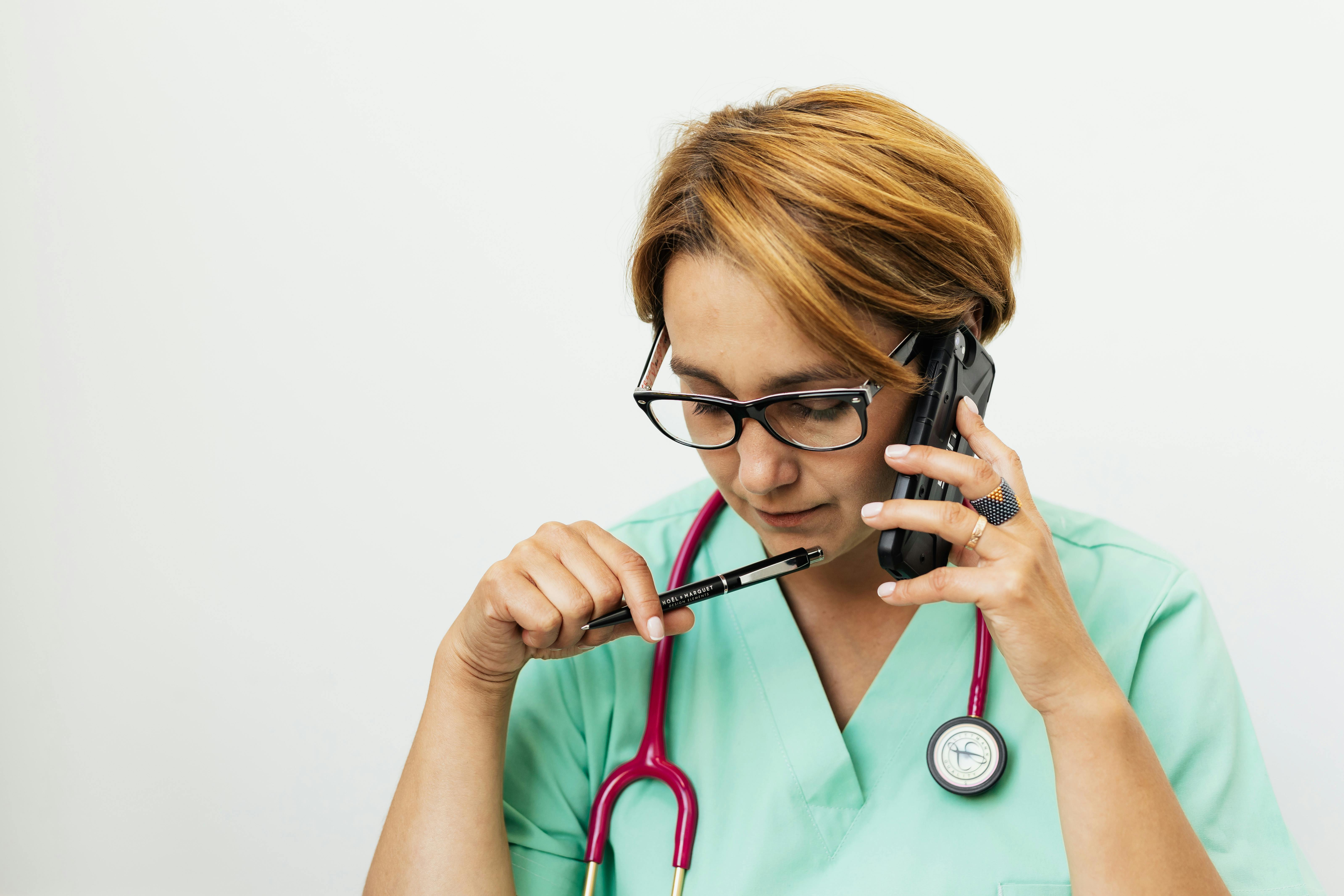 Doctor on phone with patient